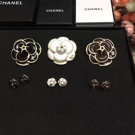 chanel camellia brooch cosmic|Chanel camellia flower earrings.